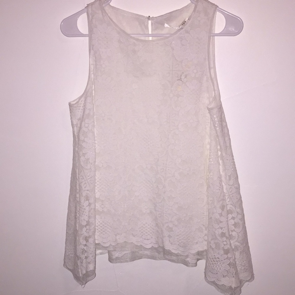 Sleeveless white lace blouse